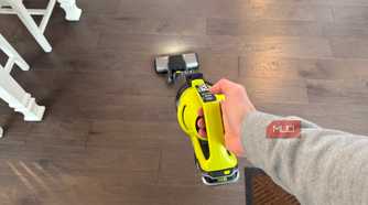 ryobi stick vacuum running in hand