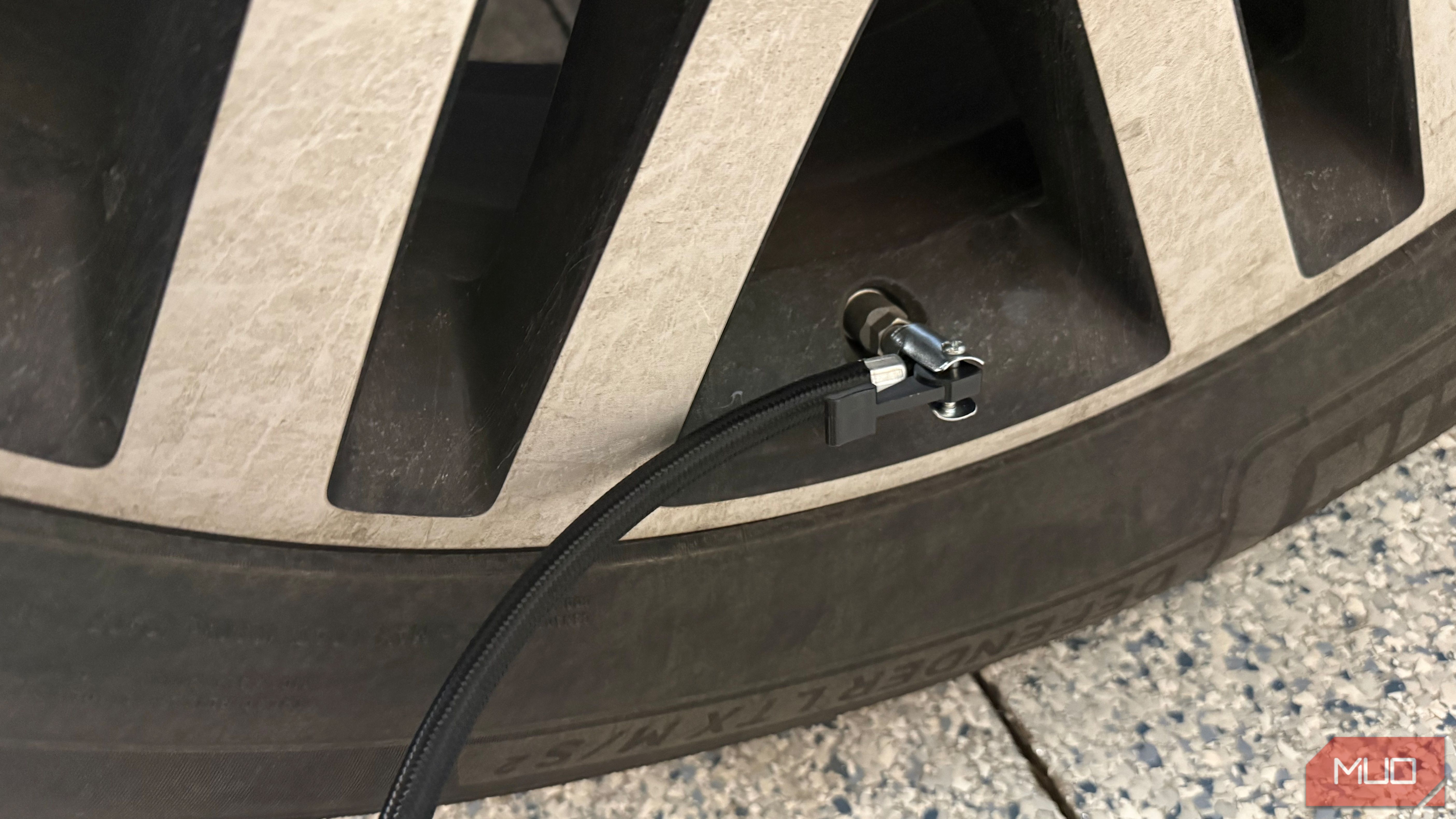 ryobi tire inflator hose connected to valve stem