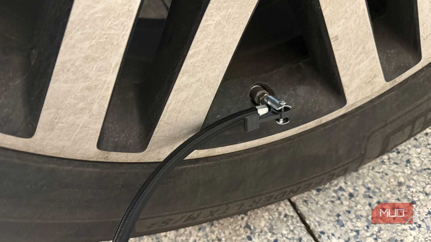 ryobi tire inflator hose connected to valve stem