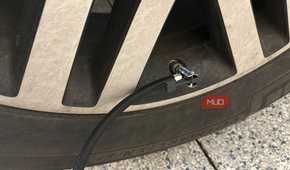 ryobi tire inflator hose connected to valve stem