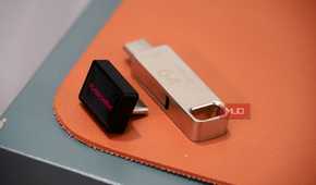 The sandisk extreme fit flash drive compared to a normal 64GB drive.