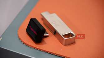 The sandisk extreme fit flash drive compared to a normal 64GB drive.
