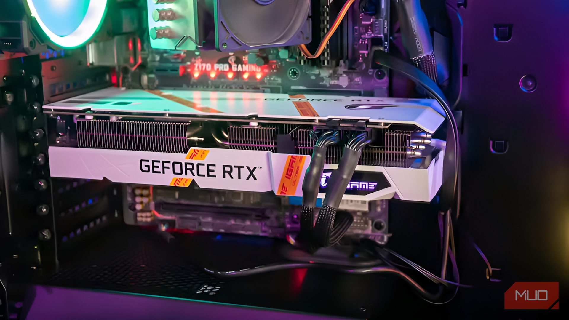 Side view of the white iGame GeForce RTX 3060 installed in a PC case showing the full length of the card.-1