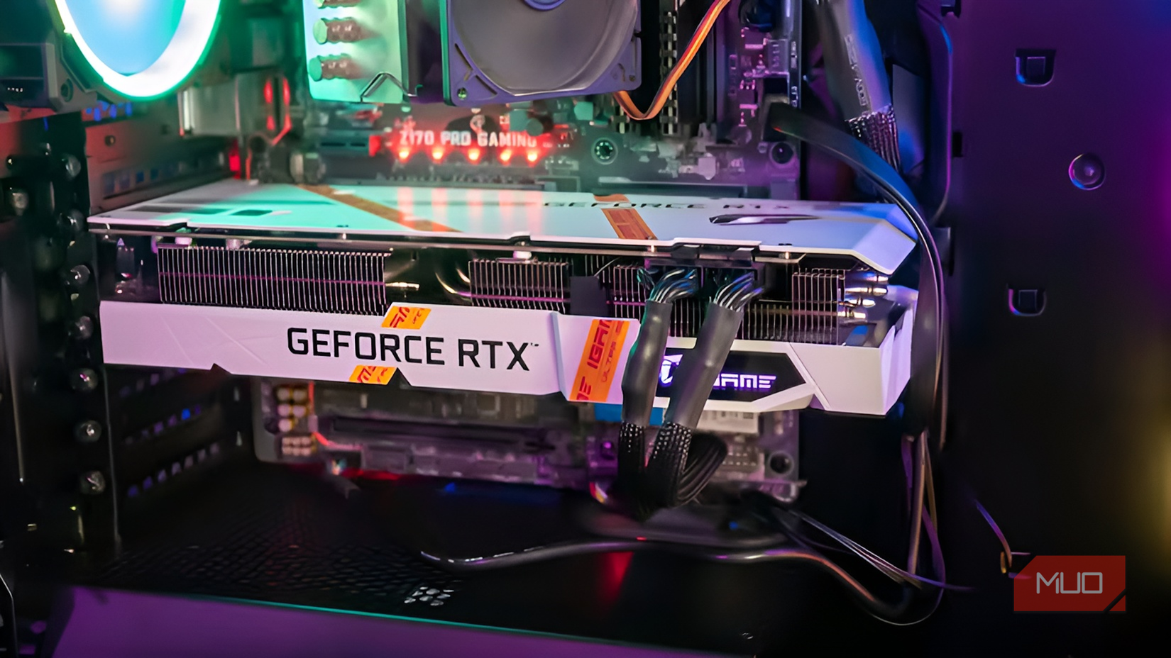 Side view of the white iGame GeForce RTX 3060 installed in a PC case showing the full length of the card.-1