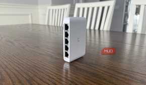 Ubiquiti compact network switch on brown table