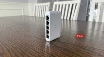 Ubiquiti compact network switch on brown table