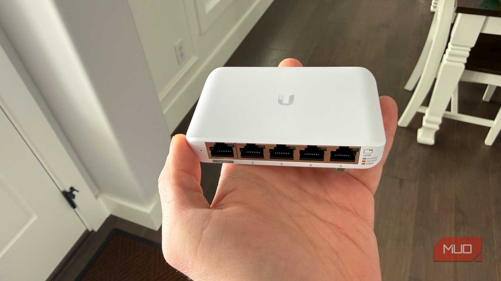 Ubiquiti compact network switch top in hand