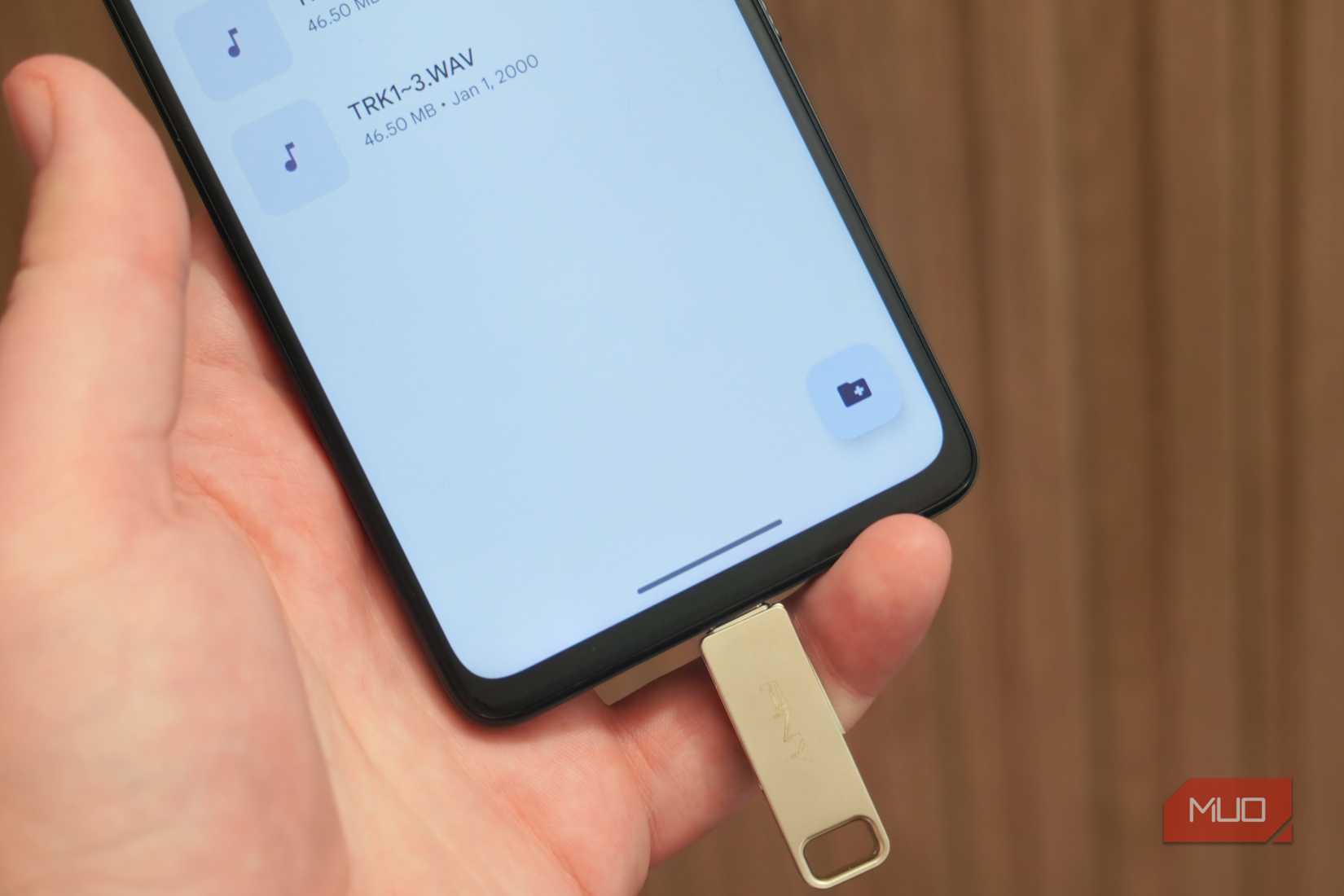 Music files on a smartphone connected to a USB drive.
