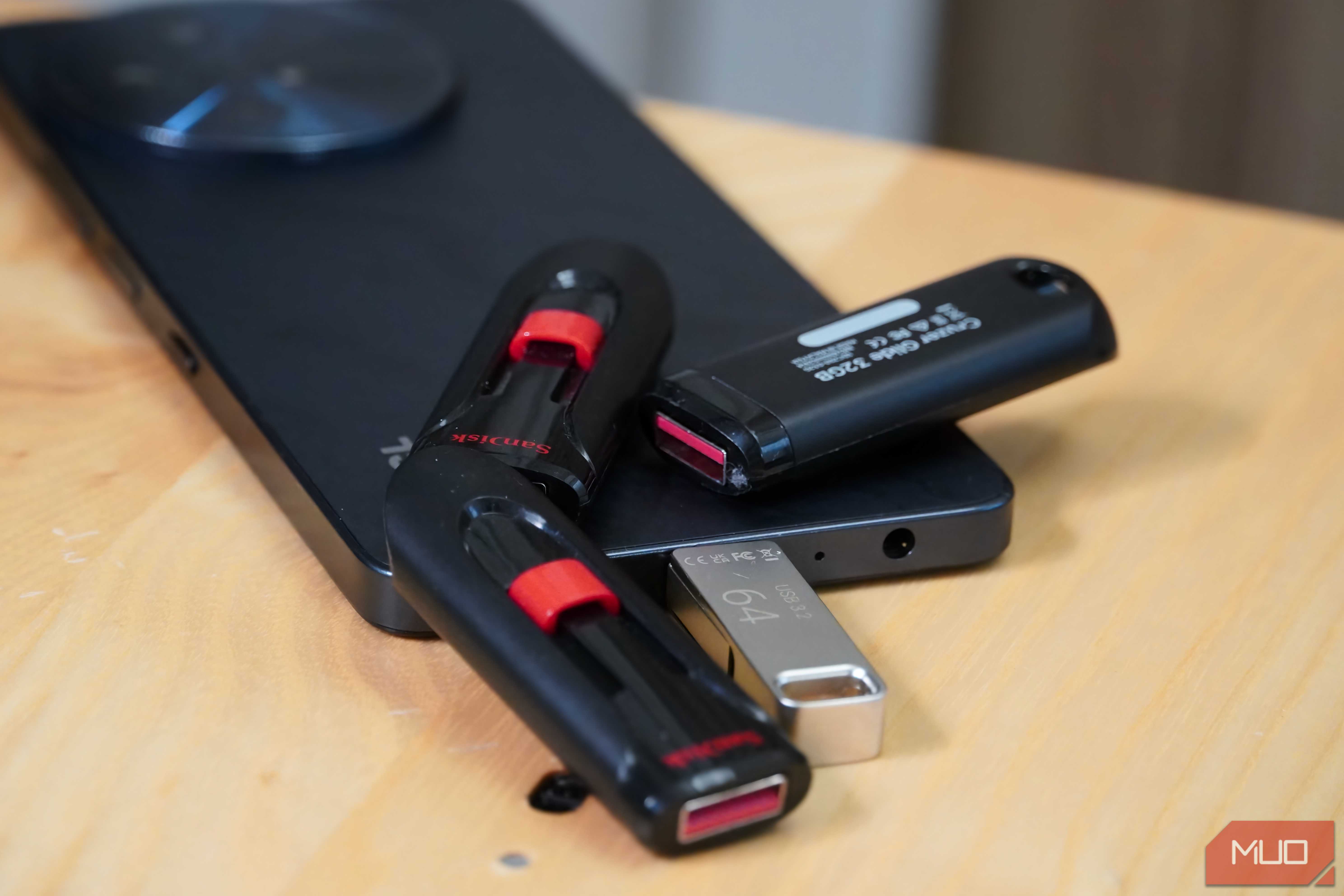 USB drives scattered around a smartphone.