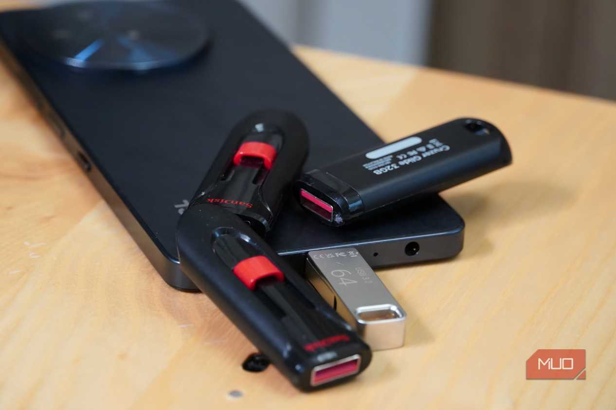 USB drives scattered around a smartphone.