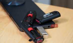 USB drives scattered around a smartphone.