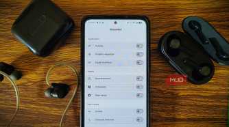 Wavelet app on Android phone surrounded with verious headphones and IEM.