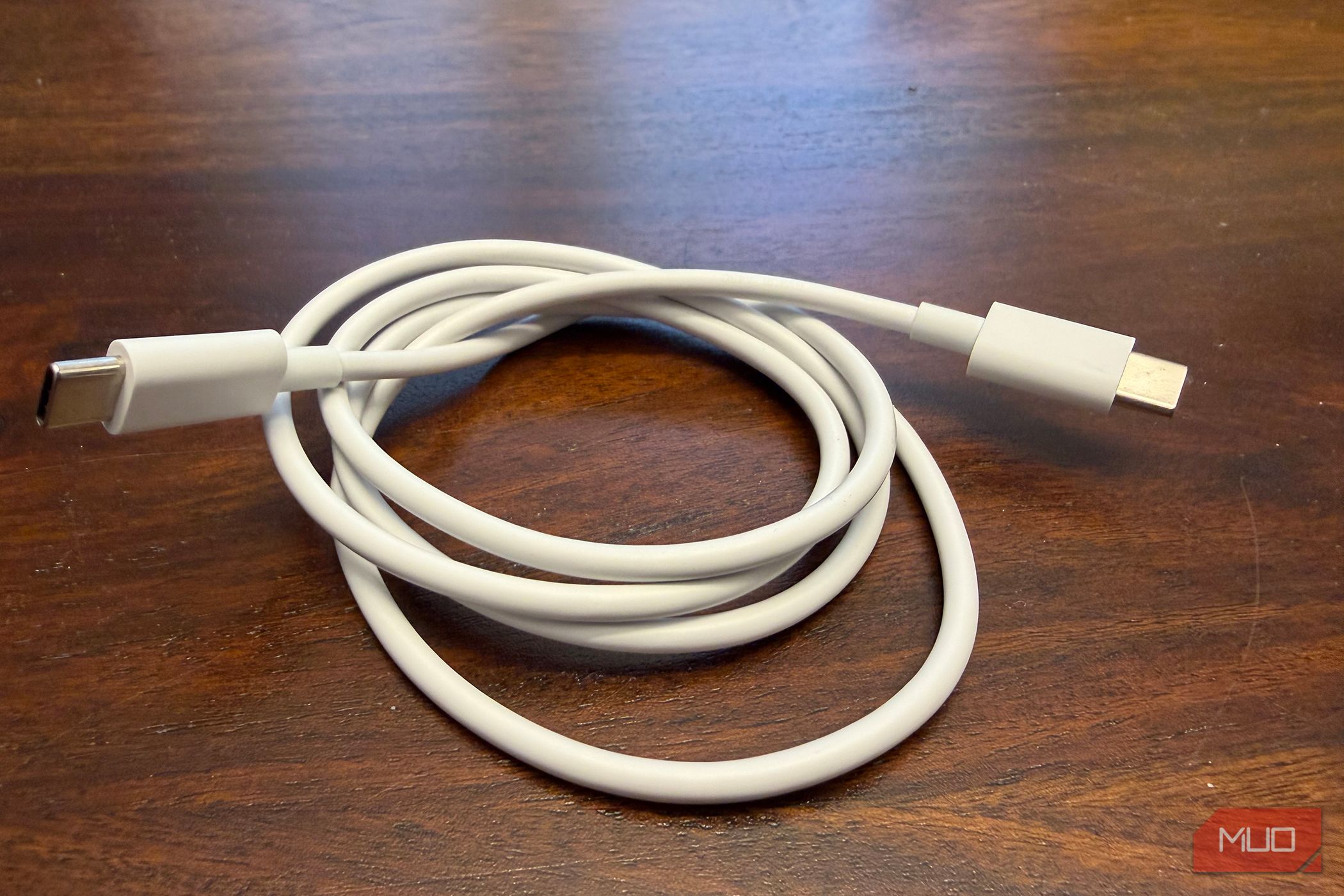 A bundled up white USB-C cable