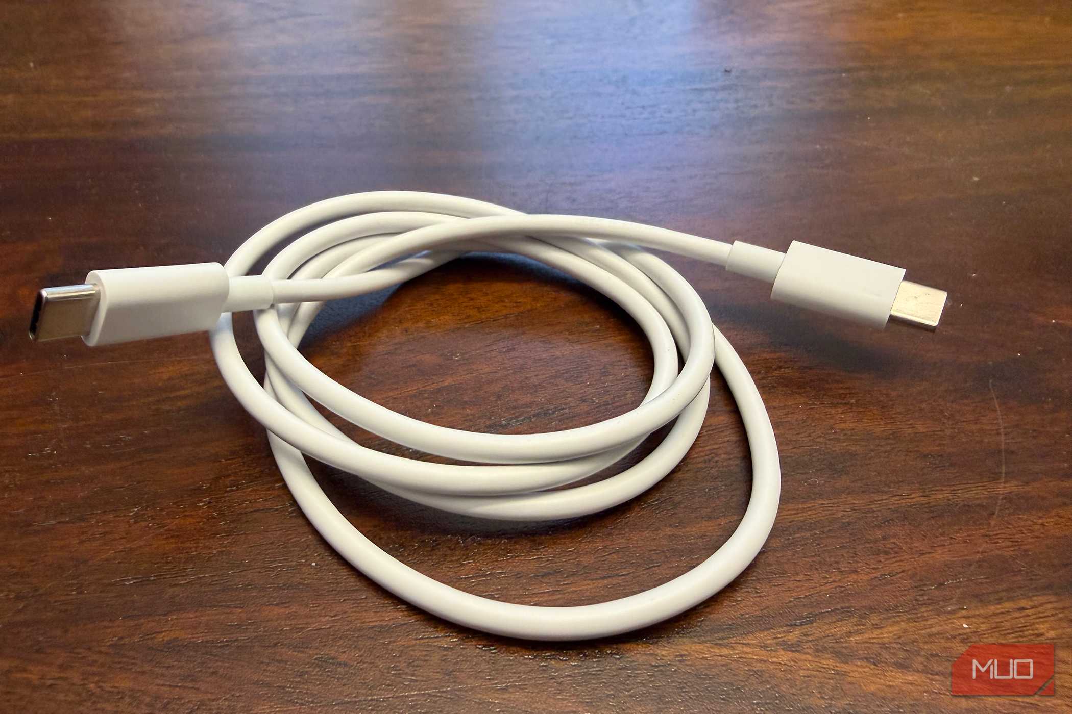A bundled up white USB-C cable