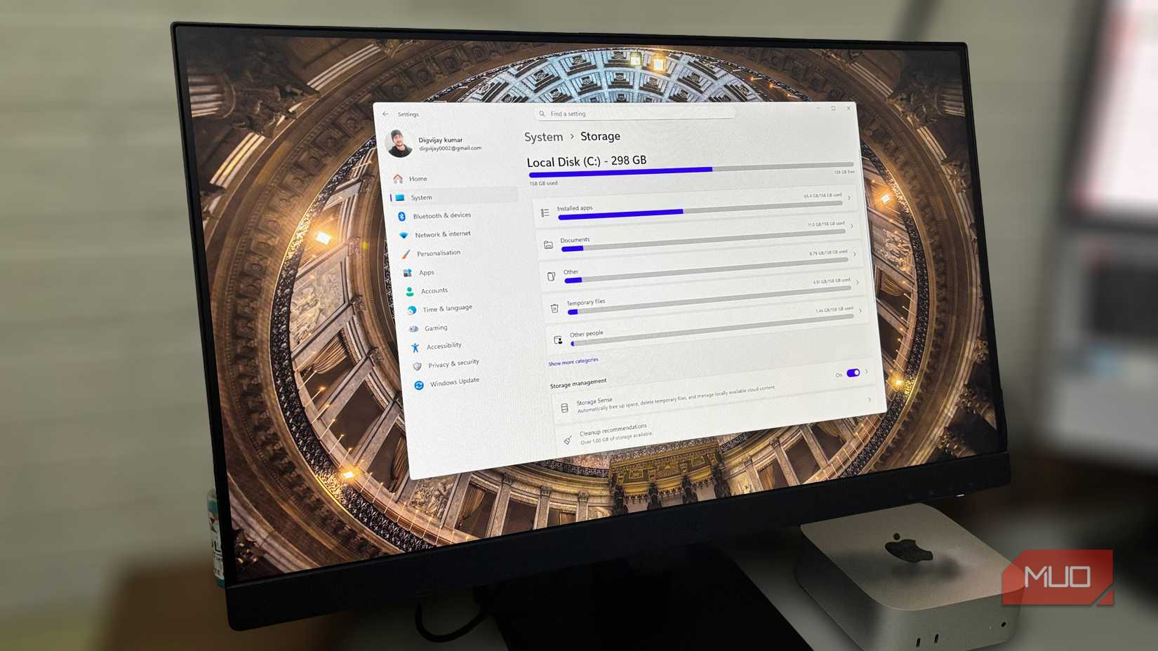 Windows Storage settings showing disk usage and Storage Sense on an external monitor.