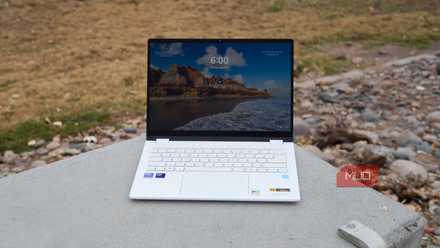 The Acer Swift Edge 14 AI with the screen on on a concrete ledge.