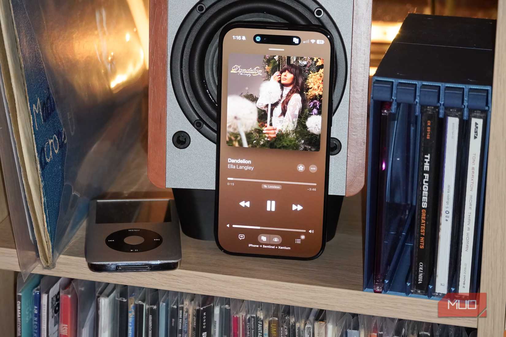 An iPhone Air resting on a speaker connected wirelessly via AirPlay 2.