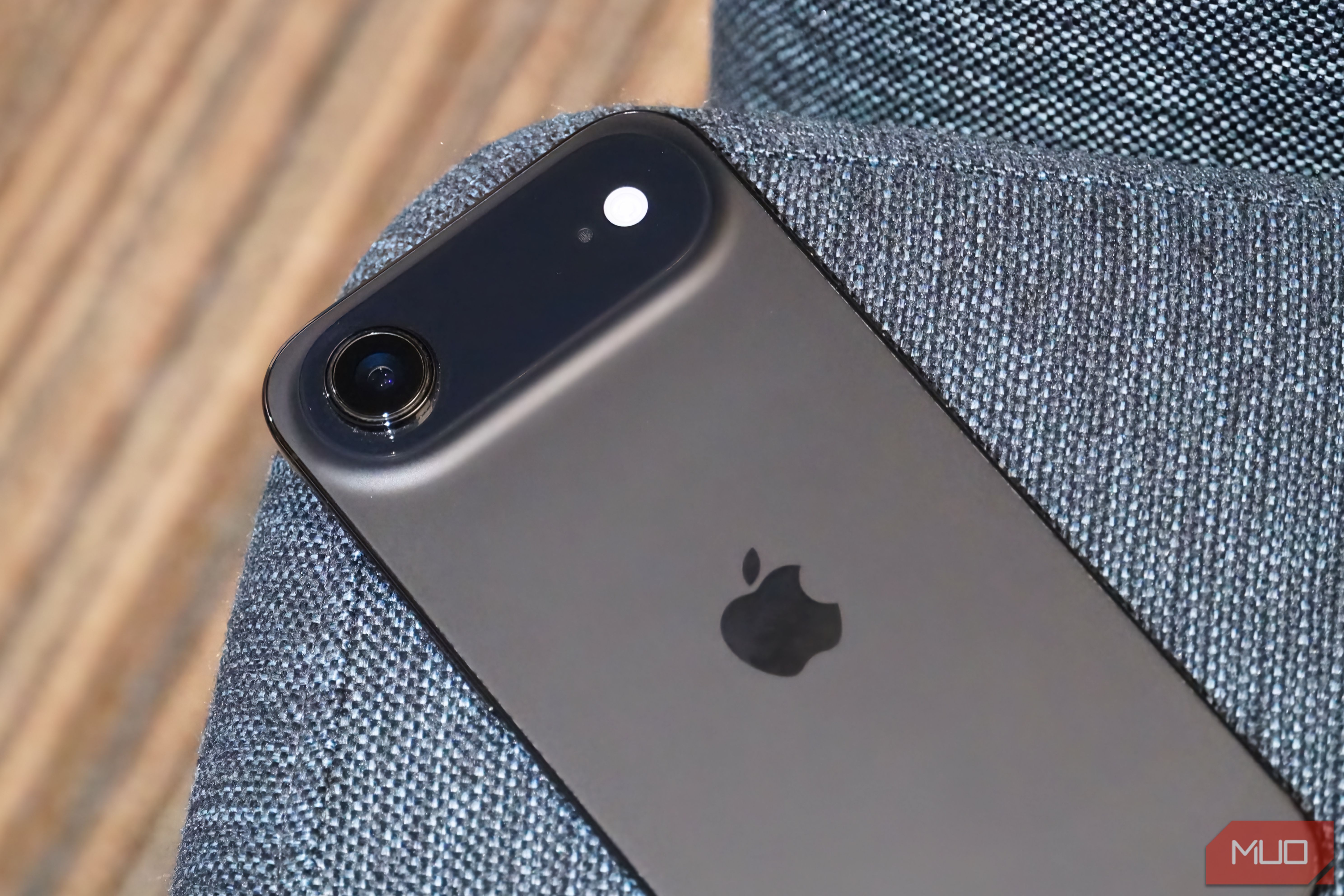 The rear camera of the iPhone Air on a chair.