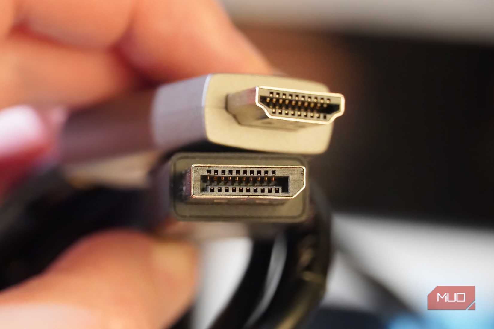 Comparing an HDMI cable to a DisplayPort cable.