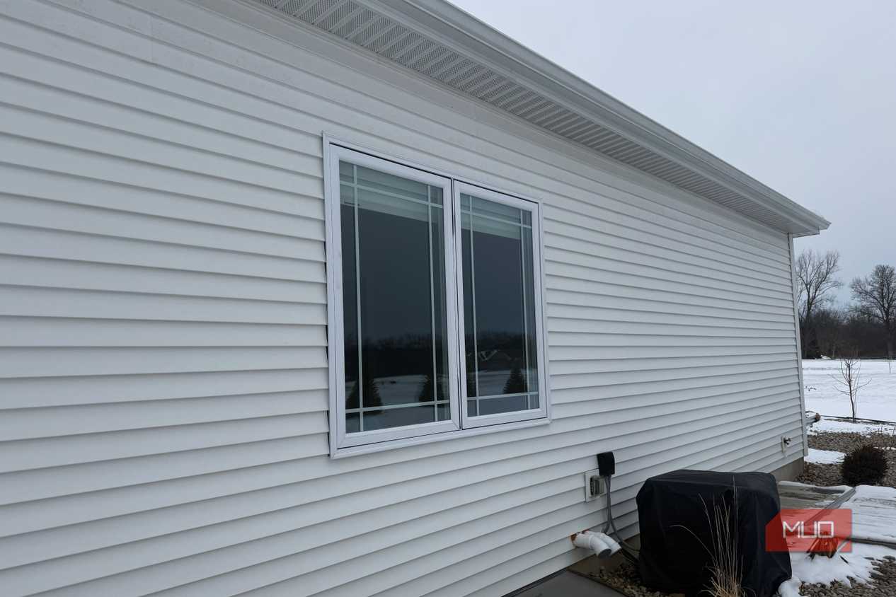 double casement window white siding