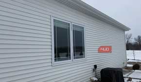 double casement window white siding