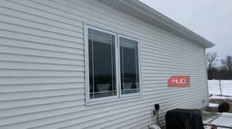double casement window white siding