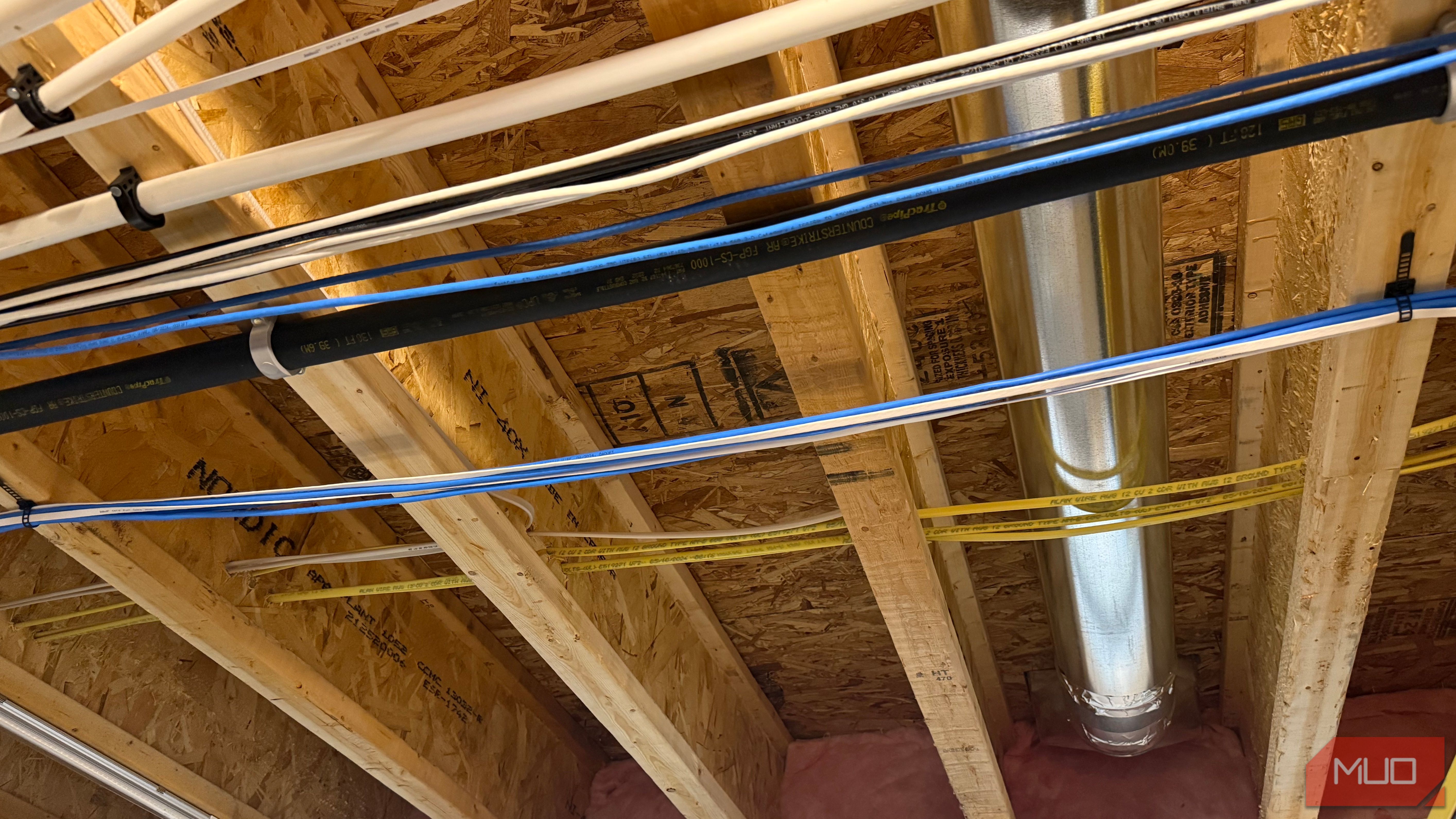 ethernet and power cables in floor joists