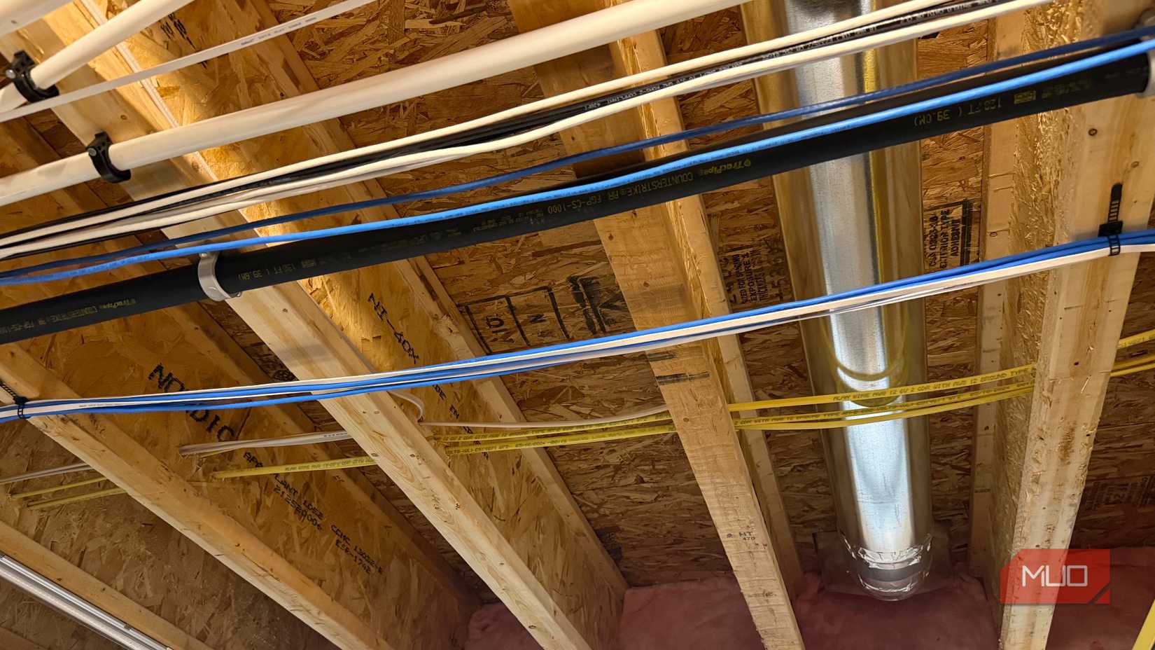 ethernet and power cables in floor joists