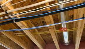 ethernet and power cables in floor joists