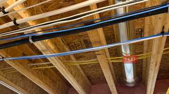 ethernet and power cables in floor joists