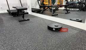 eufy x10 omni vacuuming home gym with mirrors
