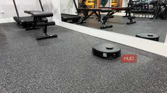 eufy x10 omni vacuuming home gym with mirrors