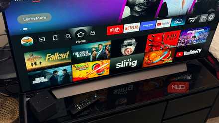 An Amazon Fire TV Cube in front of a television.
