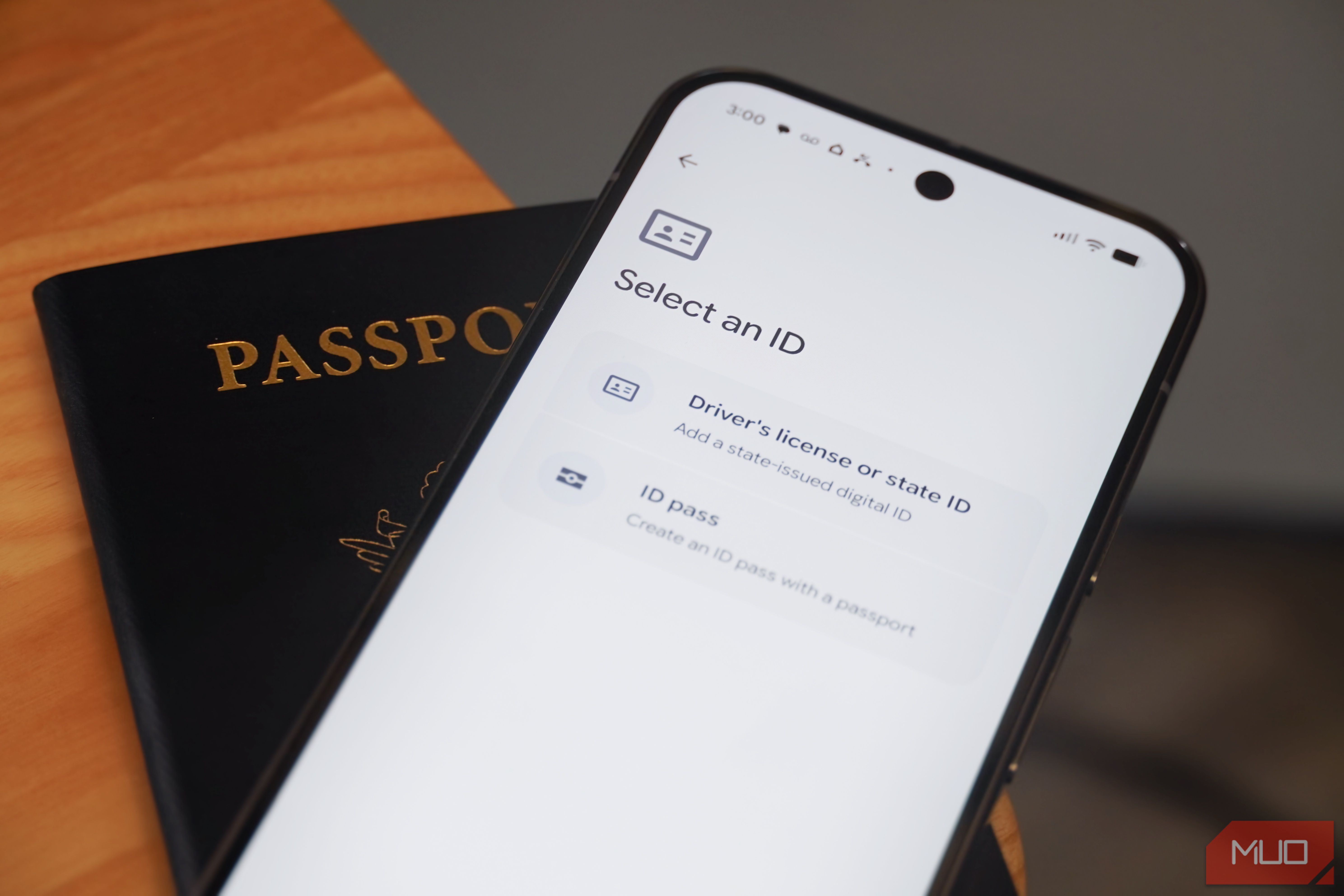 Google Wallet on an Android phone above a passport.