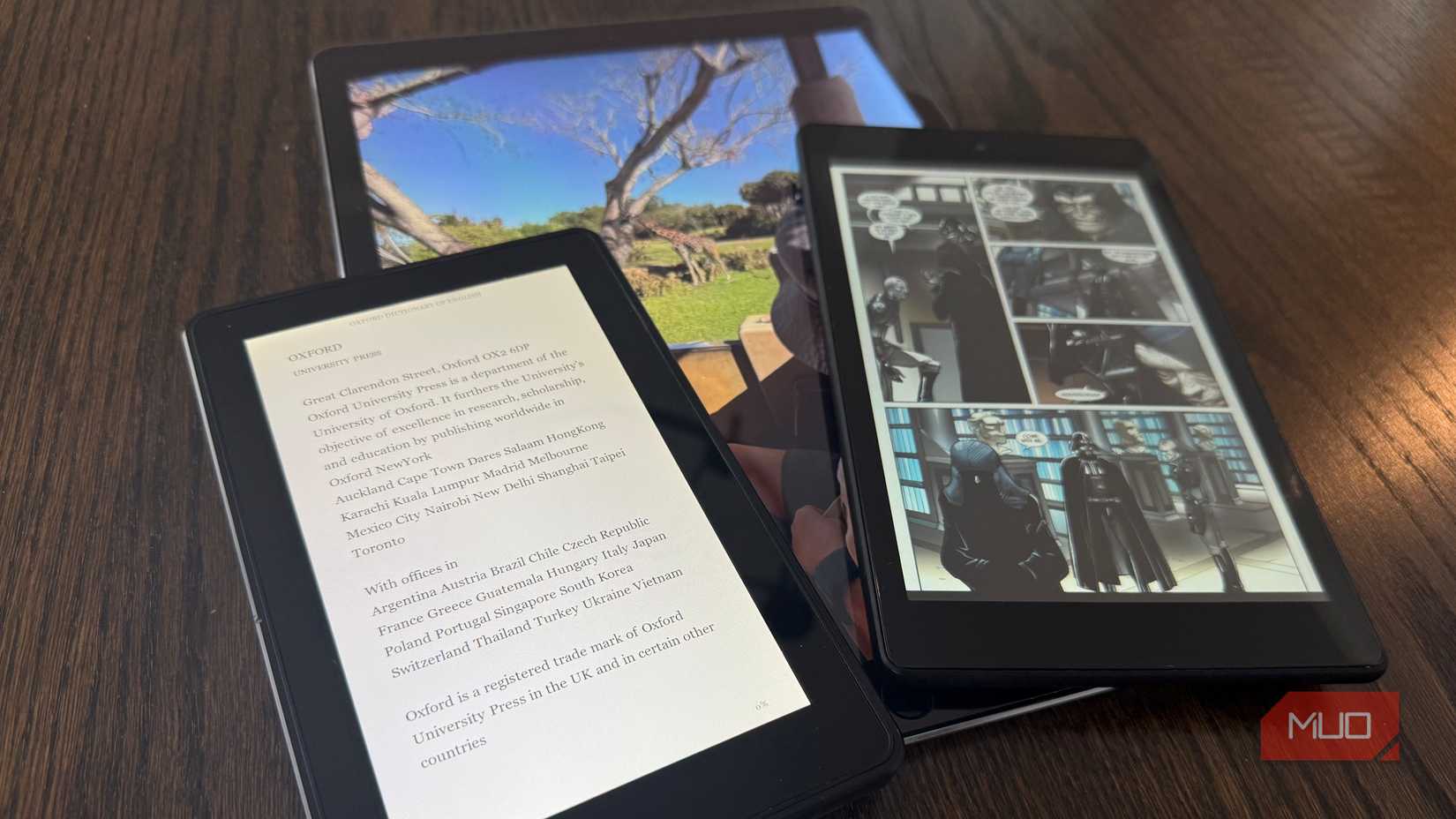 kindles and ipad pro stacked on top