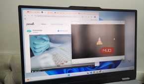 Laptop showing browser and VLC