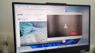 Laptop showing browser and VLC