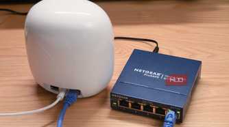 A Google Nest Wi-Fi Pro connected to an unmanaged Ethernet switch.