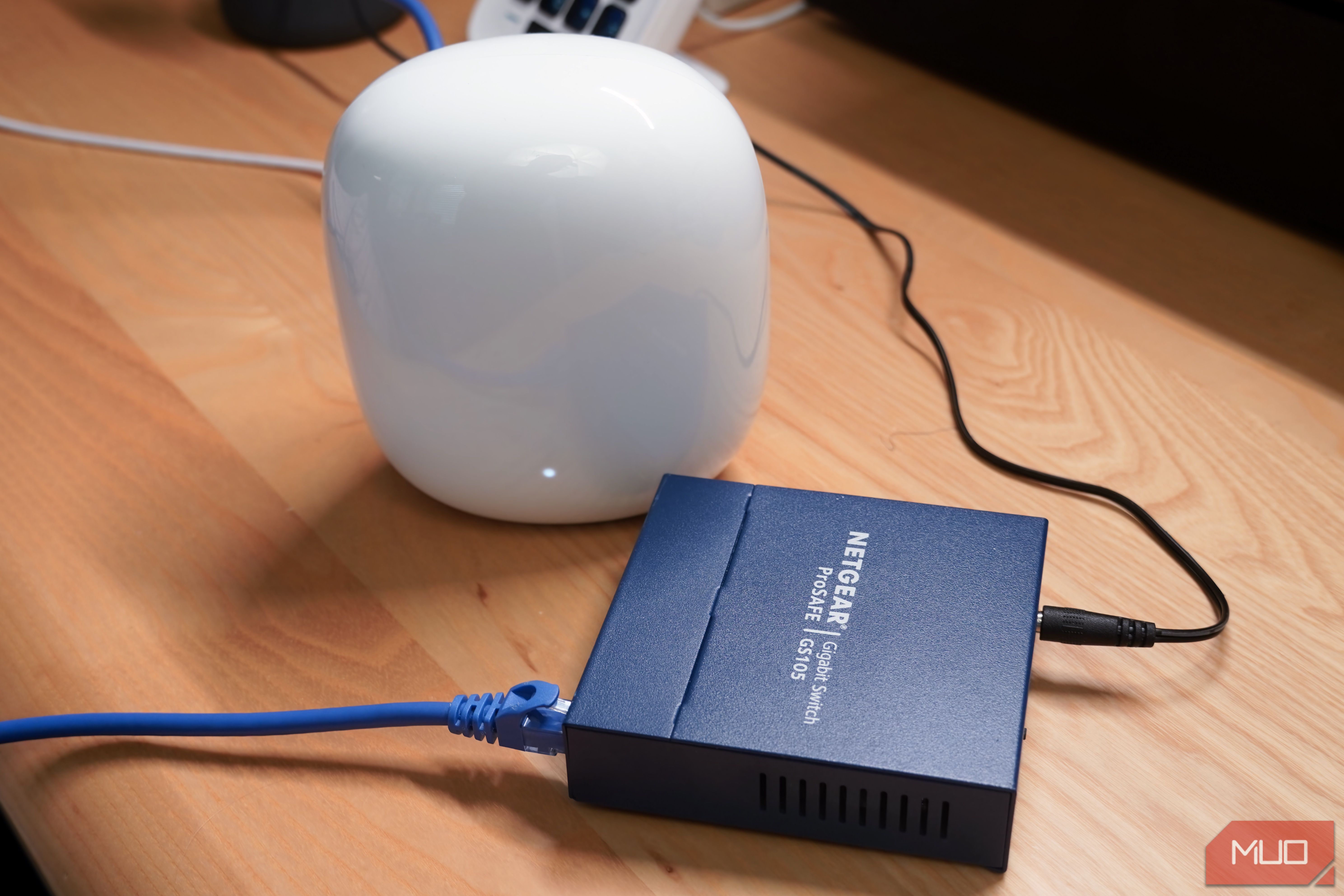 An unmanaged switch connected to a Google Nest Wi-Fi Pro router.