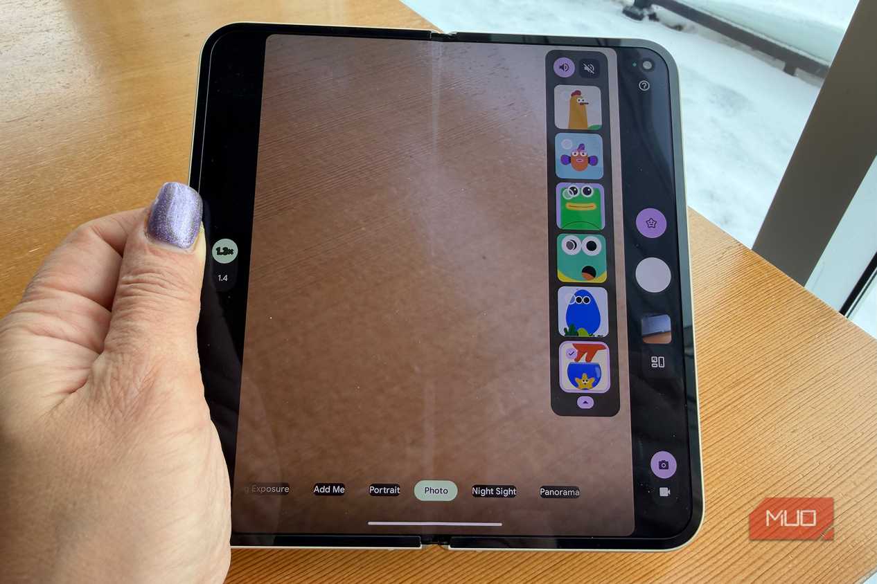 A hand holding a Google Pixel 10 Pro Fold showing different Made You Look animation options on the inner screen.