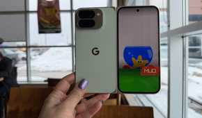 A hand holding a Google Pixel 10 Pro Fold phone with the Made You Look animation on the front.