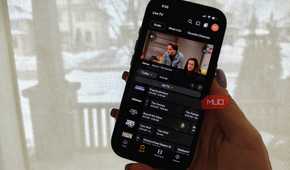 A phone showing the Plex live TV guide and The Conners playing in a small window.