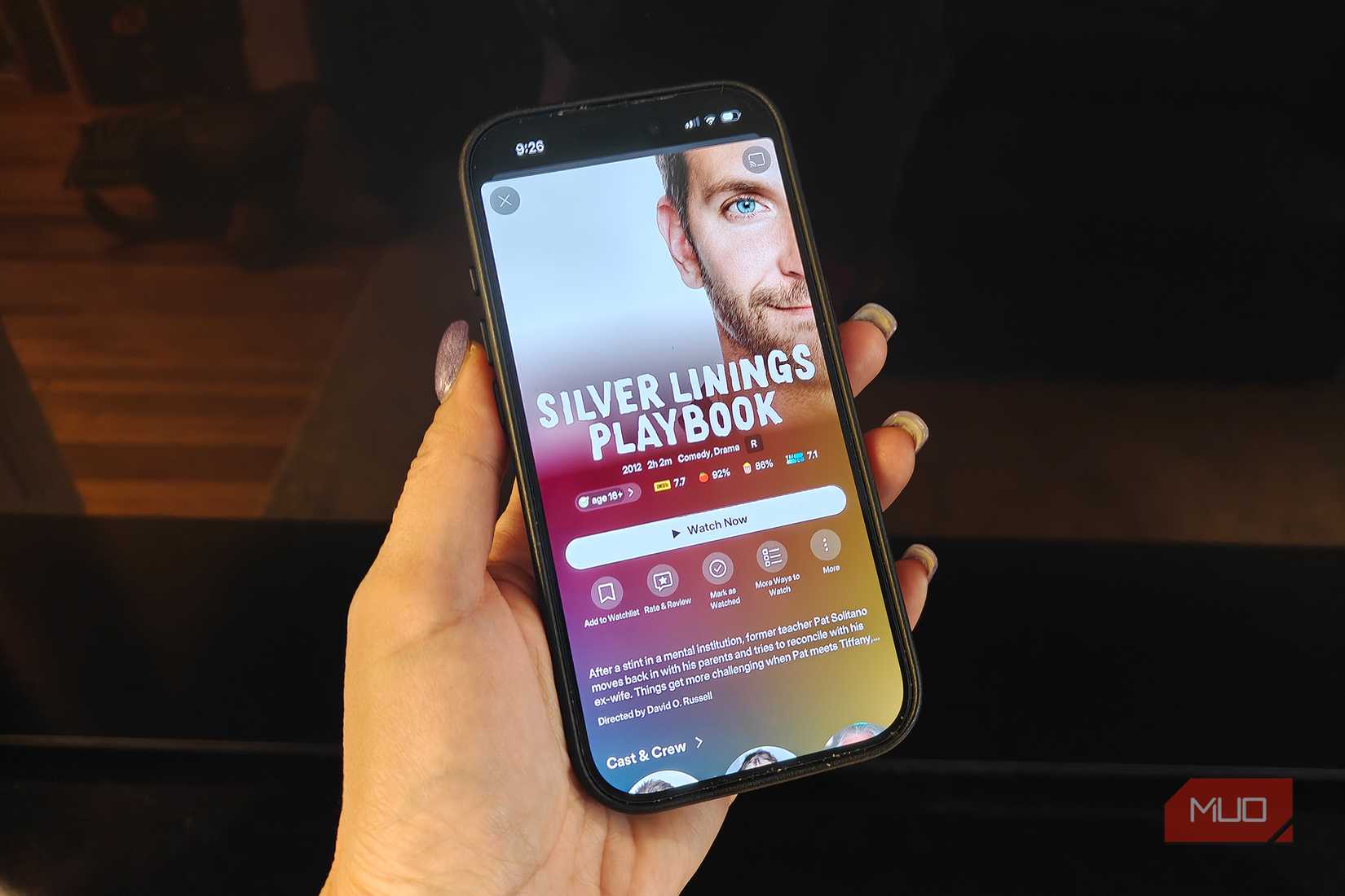 A phone showing Silver Linings Playbook playing on Plex.