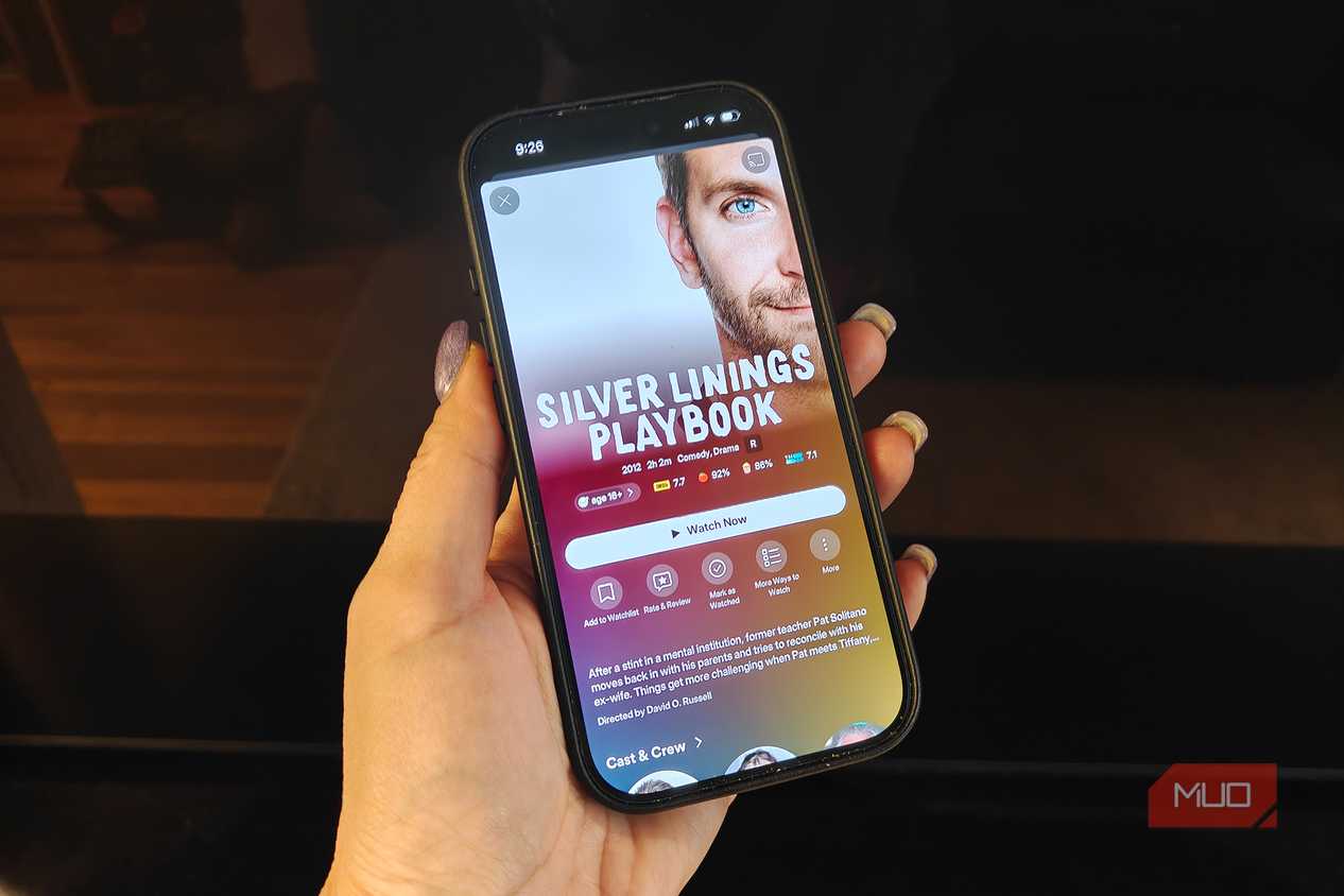 A phone showing Silver Linings Playbook playing on Plex.