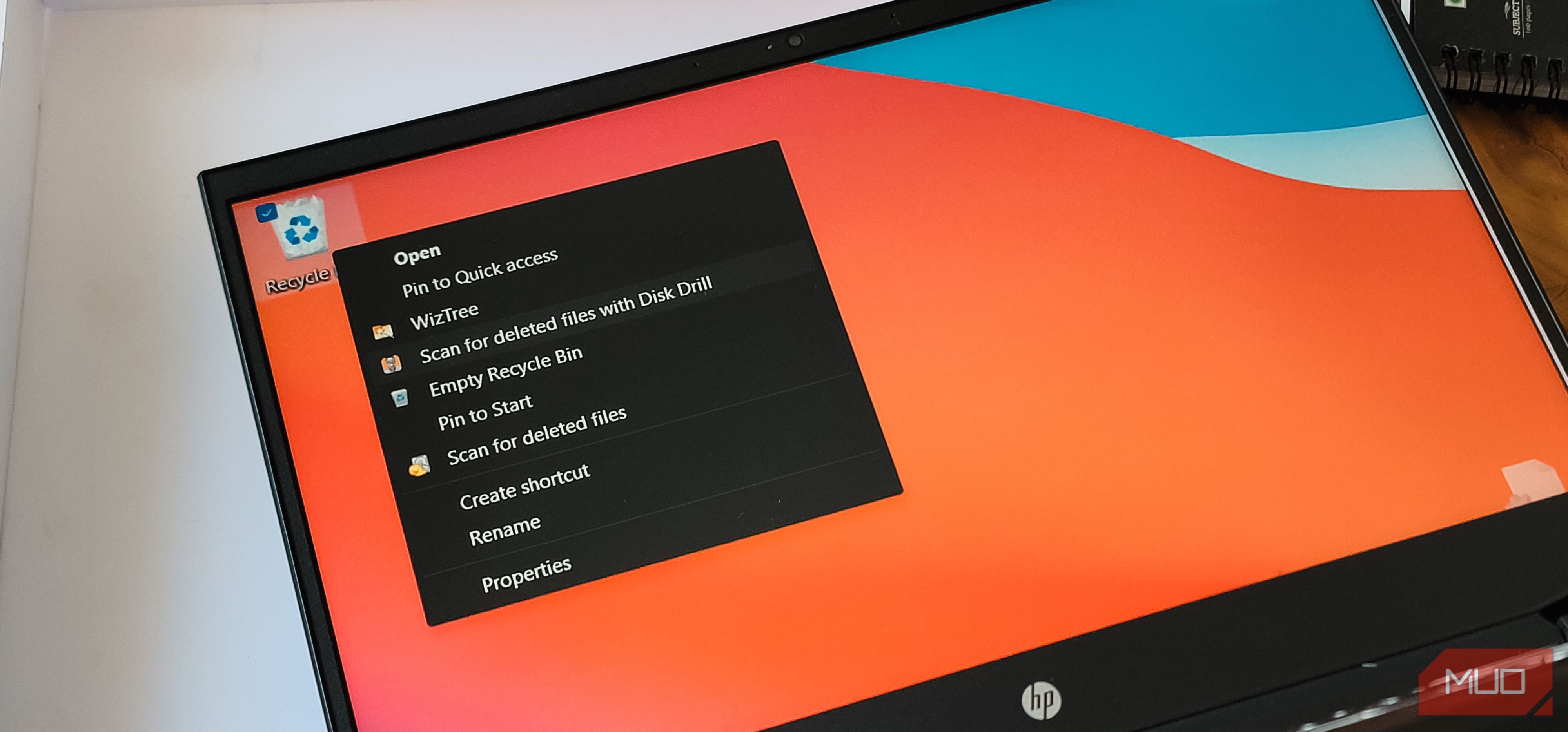 Recycle bin context menu open on Windows 11 and a HP Laptop