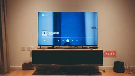 HDTV on a TV stand, up against a wall