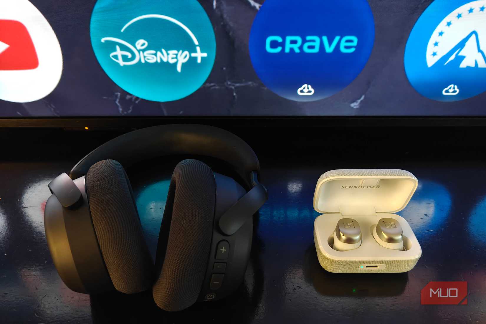 Sennheiser RS 275 headphones beside the Sennheiser Momentum True Wireless 4 earbuds.