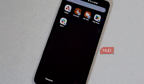 Smartphone showing isolated work profile apps, including Asana and Slack, with the Work tab selected.
