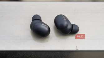 The Sony WF-1000XM6 earbuds on a railing.