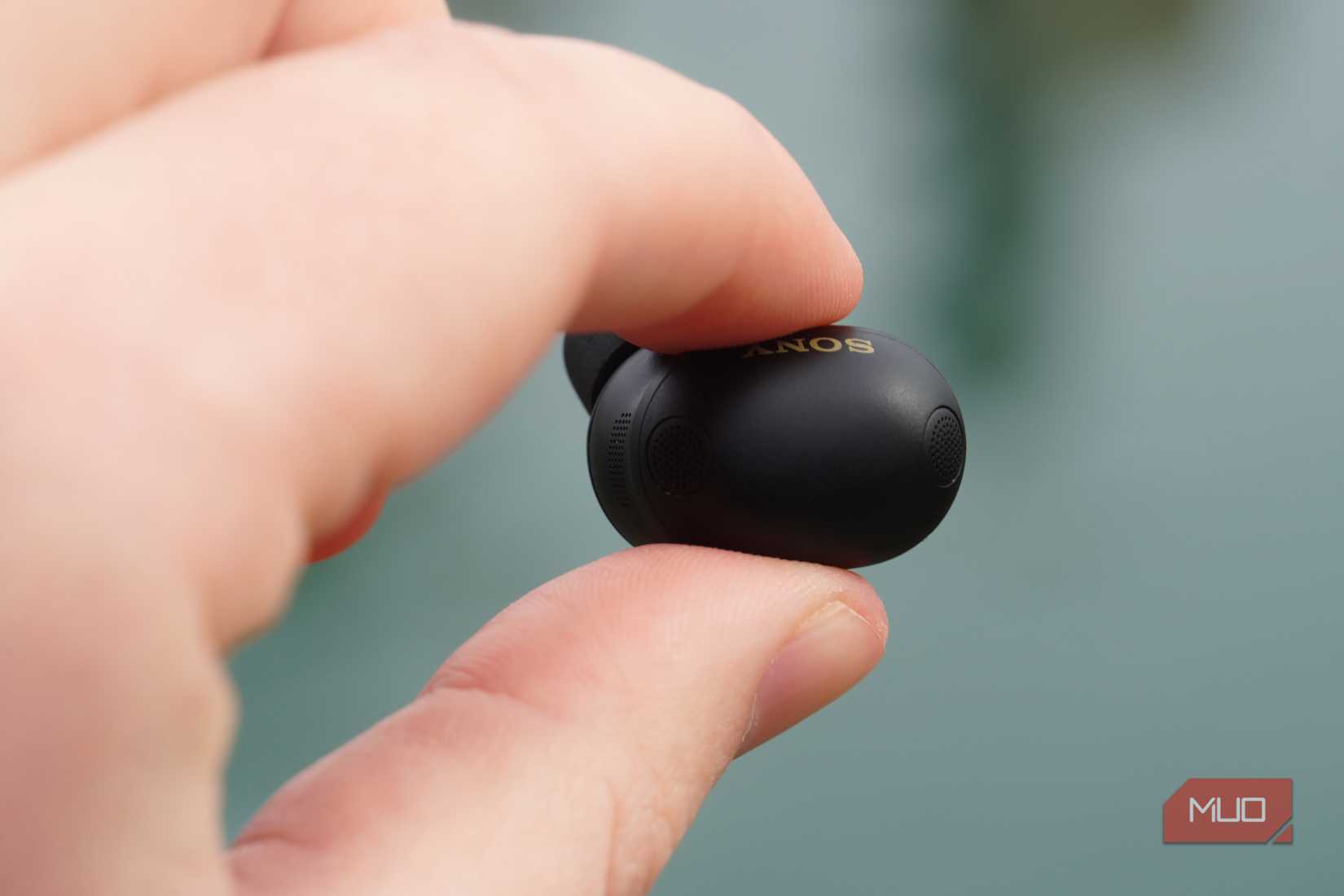 The Sony WF-1000XM6 earbuds in the hand.